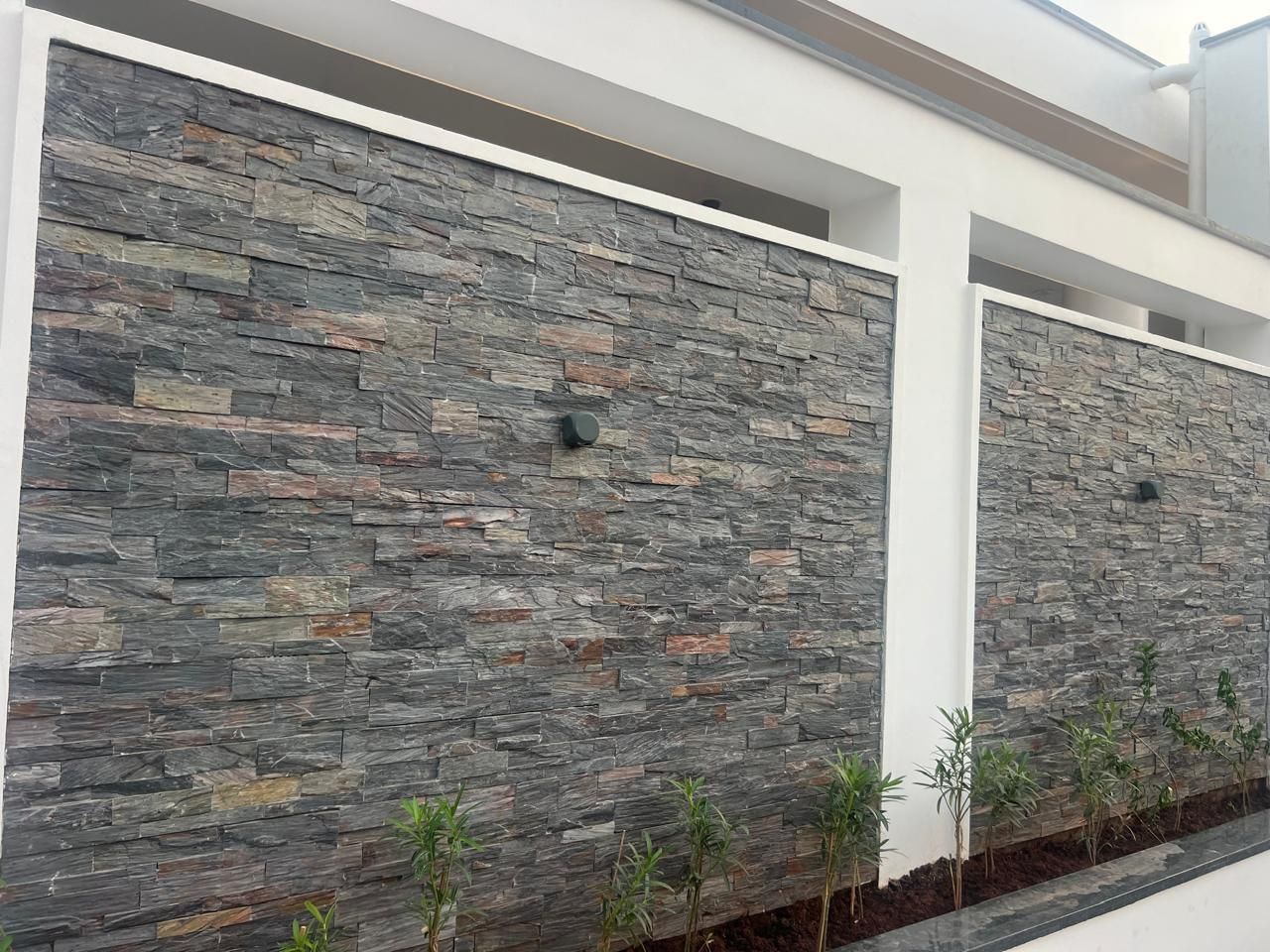 Grey ledgestone boundary wall